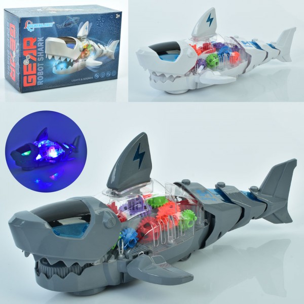 156709 Музична іграшка S-1 акула, їздить, шестерні,рухомі частини,2 кольори,муз.,світло,бат.,кор.,20-13-9см